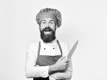 chef with knife. Cooking and professional culinary concept. Cook with cheerful faceの写真素材