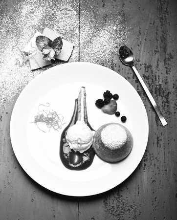 Dessert served with orange noodles in cafe or bakery.の写真素材