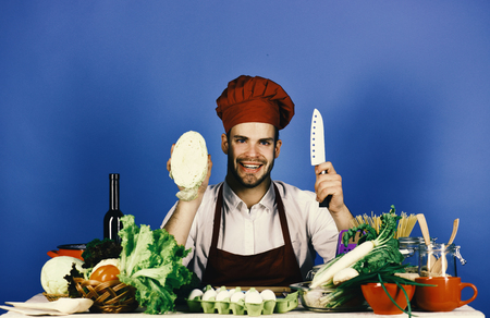 Cook with happy face on blue background.の写真素材