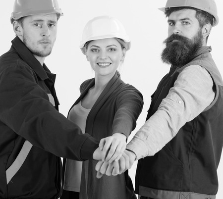 Teambuilding concept. Builder, engineer, labourer, repairman as friendly teamの写真素材