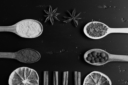 Composition of condiment, top view. Wooden spoons with spicesの写真素材