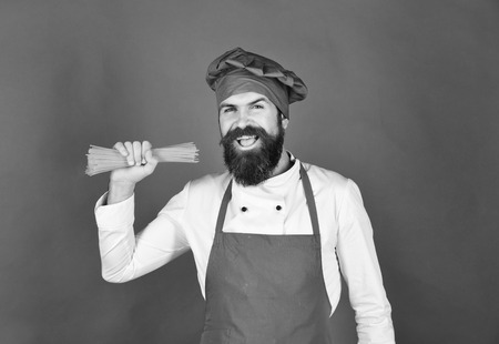 Chef with bunch of spaghetti. Cook with smiling faceの写真素材