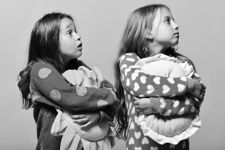 Friends in pink pajamas isolated on pink backgroundの写真素材