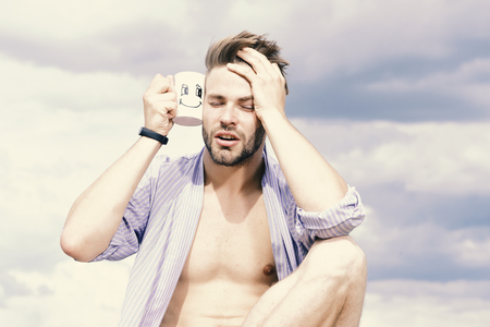 Male model posing against the sky.の写真素材