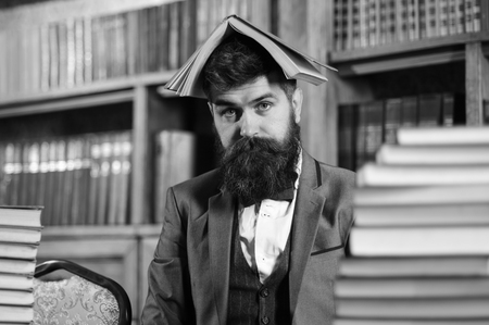 young unshaven man with bored face and classic clothesの写真素材