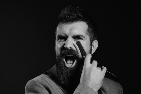 Barber shop. Hair style. Business and barbershop service concept. Businessman with mad faceの写真素材