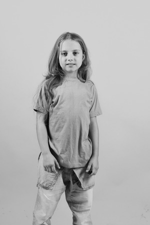 beautiful girl. Child looks like hip hop star wearing casual clothesの写真素材