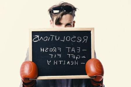 Man in red boxing gloves on white background.の写真素材