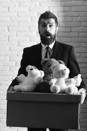 Man with beard and astonished face makes donation.の写真素材