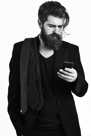 Brutal caucasian hipster holding cell phoneの写真素材