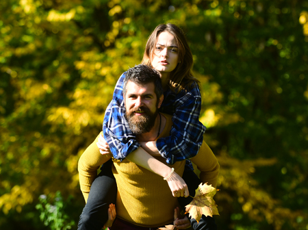 Happy couple having fun outdoors in parkの写真素材