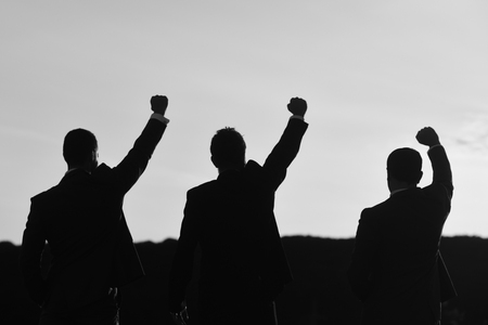 Business and success concept. Leaders discuss, project hold hands up.の写真素材