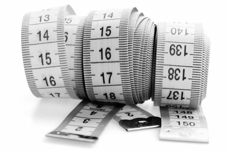 Measuring tapes of tailor with indicators in form of centimeters. Sewing and measuring concept.の写真素材