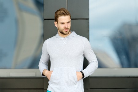 Confident sportsman in casual style. Male fashion. Bearded man stand on urban outdoor. Ready for...