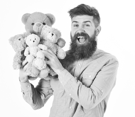 Portrait adult man with beard and mustache with teddy bears on white backgroundの写真素材