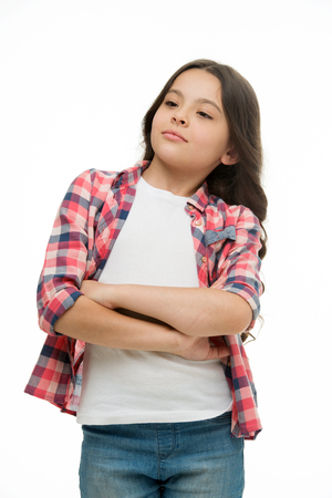 Problem solved. Girl confident face feels superiority. Girl folded arms on chest looks cool, isolated white background. Kid enjoy her superiority or fame. Childs arrogant behaviourの写真素材