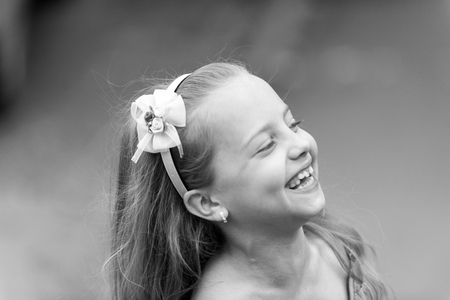 Cute little girl smiling in parkの写真素材