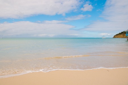 Sea beach in St johns, Antigua. Transparent water at beach with white sand. Idyllic seascape....