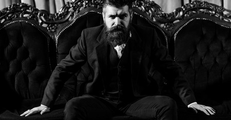 Bearded man in dressing with serious faceの写真素材