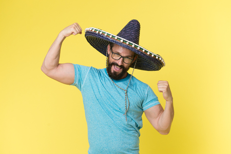 Mexican concept. Happy man smile in mexican hat. Mexican man in sombrero hat. Mexican party celebrationの写真素材