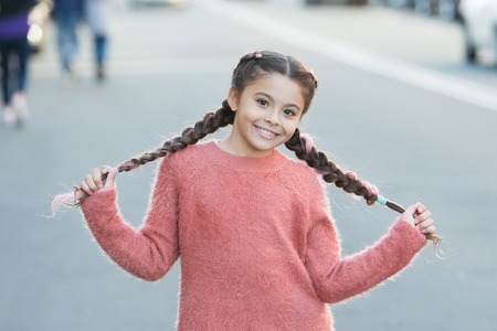 Autumn fashion for pretty girl. Happy childhood. Autumn snuggles. Small child with long hair....