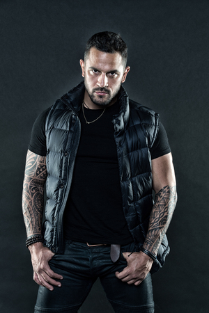Masculinity and fashion concept. Tattoo brutal attribute. Man confident unshaven brutal appearance tattooed arms. Tattoos great way express masculinity and manliness. Bearded man posing with tattoos.の写真素材