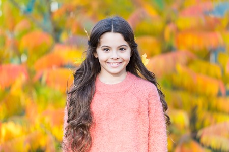 Fashion should be stylish and fun. Small girl on autumn landscape. Girl child in fashion clothing....
