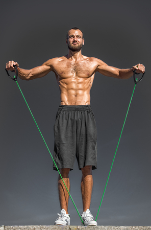 Athletic man with sport equipment.の写真素材