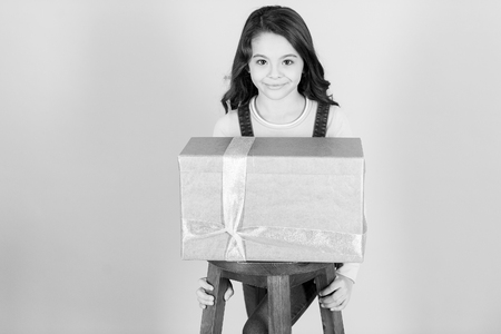 Kid girl with present gift ribbon box.の写真素材