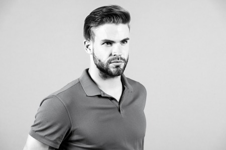 Handsome bearded man in blue tshirt with stylish hair