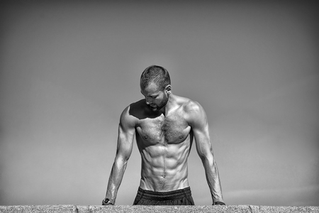 Im sexy cause I am a sportsman. Muscular man perform sport activities. Athletic man with muscular strength. Sport and fitness. Believe and achieve. Good health is good, black and white.の写真素材