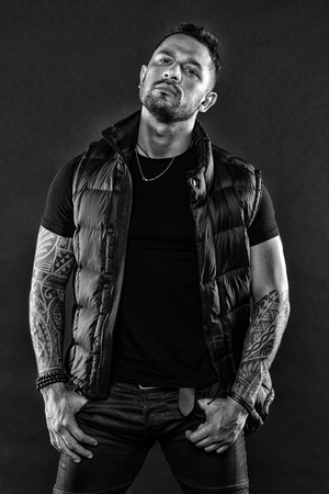 Bearded man posing with tattoos. Masculinity and fashion concept. Tattoo brutal attribute. Man confident unshaven brutal appearance tattooed arms. Tattoos great way express masculinity and manliness.の写真素材