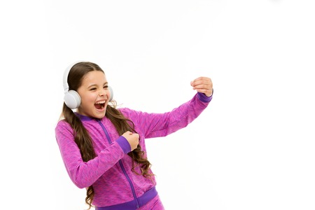 Get music subscription. Access to millions of songs. Enjoy music everywhere. Best music apps that deserve a listen. Girl child listen music with modern headphones isolated white. Listen for free.の写真素材