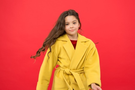 Little kid with stylish long hair.の写真素材