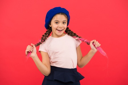 Kid little cute girl smiling face posing in hat redの写真素材