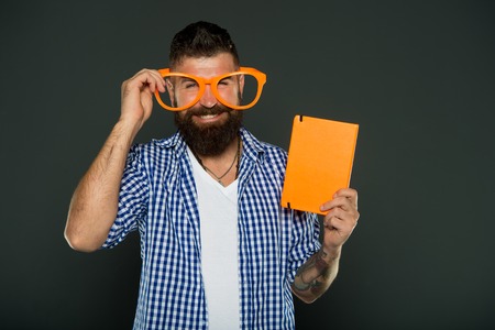 Happy man with glasses and e-book.の写真素材