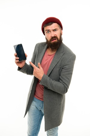 User outraged. Man brutal bully appearance hold smartphone isolated white.の写真素材