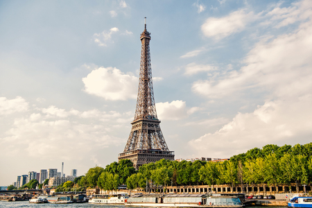 Eiffel Tower at sunset in Paris, France. Romantic travel background. Eiffel tower is traditional symbol of paris and love.の写真素材