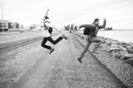 Men travellers wear warm protective clothes for cold climate conditions. Travellers well equipment ready explore scandinavian or nordic country. Excited traveller concept. Lets start our travel.の写真素材