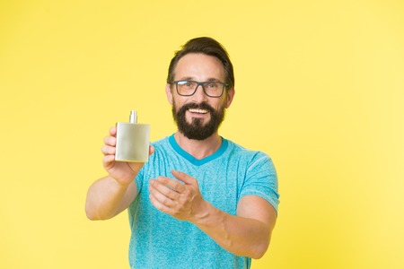 Make sure smell fresh throughout day. Amazing benefits of using perfumes. Man bearded handsome hold...
