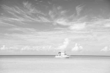 Yacht in sea of St johns, Antigua. Yacht on idyllic seascape. Summer vacation on tropical island. Travelling by sea on yacht. Adventure is out there. Discovery. Yacht travel by ocean.の写真素材