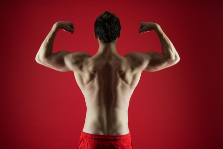 Challenging himself. man exercising in gym. Sport and fitness.の写真素材