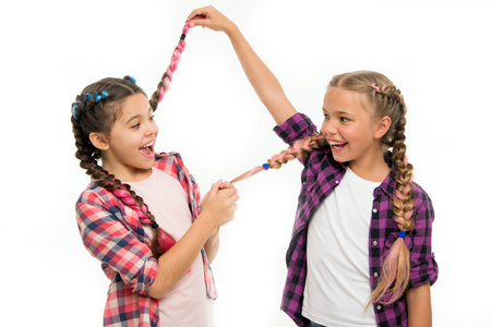 Childhood happiness. Friendship and sisterhood. Happy little sisters. Beauty and fashion. small kid fashion. childrens day. Back to school. small girl children with perfect hair. Look at this.の写真素材