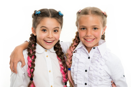 small kid fashion. Childhood happiness. Friendship and sisterhood. small girl children with perfect hair. childrens day. Back to school. Happy little sisters. Beauty and fashion. Amazing story.の写真素材
