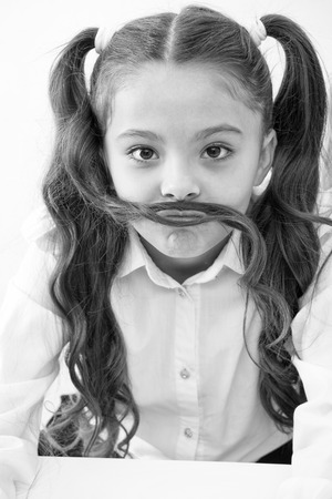 small girl with funny mustache. Small girl with long hair style.の写真素材