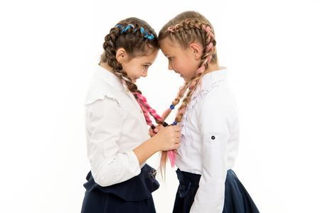 small girl children with perfect hair. Childhood happiness. Friendship and sisterhood. childrens day. Back to school. small kid fashion. Happy little sisters. Beauty and fashion. Lost in thoughts.の写真素材