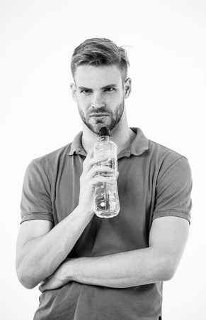 Sip of freshness after great workout. Man athlete hold water bottle. Athlete drink water after training. Man athlete hold bottle. Sportsman care hydration body. Athlete healthy lifestyle concept.の写真素材