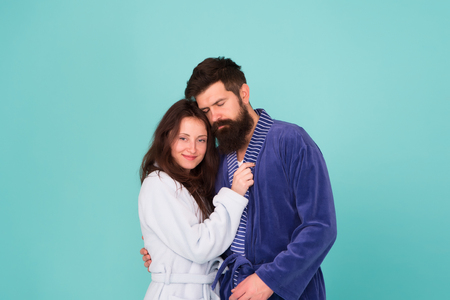 Sleepy man embrace his girl. Bearded man and woman in robe pajama. Couple in love. sleepy family. Wake up morning. Love and romance. Happy family in morning. couple looks sleepy in morning. Insomnia.の写真素材
