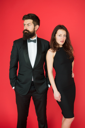 All black dress code. Official event concept. Man bearded wear tuxedo girl elegant dress. Visiting event or ceremony. Couple classy clothes. Elite event. Main rules picking clothes. Corporate party.の写真素材