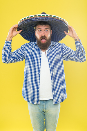 Perfect for sun protection. Traditional fashion accessory for theme costume party. Hipster in wide brim hat. Mexican man wearing sombrero. Bearded man in mexican hat. He is in love with mexican style.の写真素材